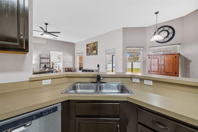 kitchen with sink, ceiling fan with notable chandelier, dark brown cabinets, decorative light fixtures, and stainless steel dishwasher