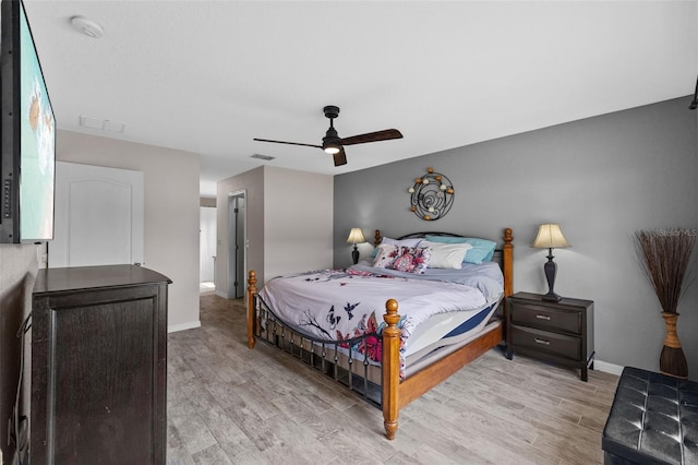 bedroom with light wood-type flooring and ceiling fan