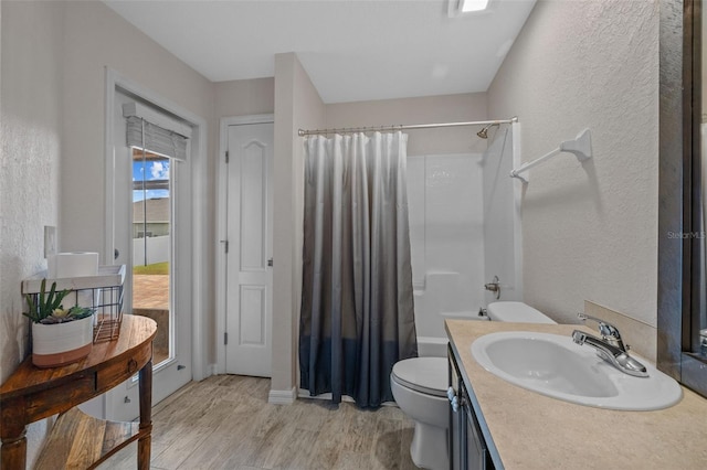 full bathroom with vanity, toilet, wood-type flooring, and shower / bath combo