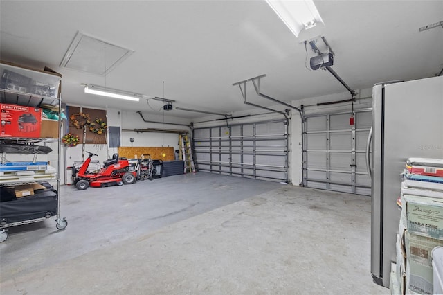 garage with a garage door opener, stainless steel refrigerator, and electric panel