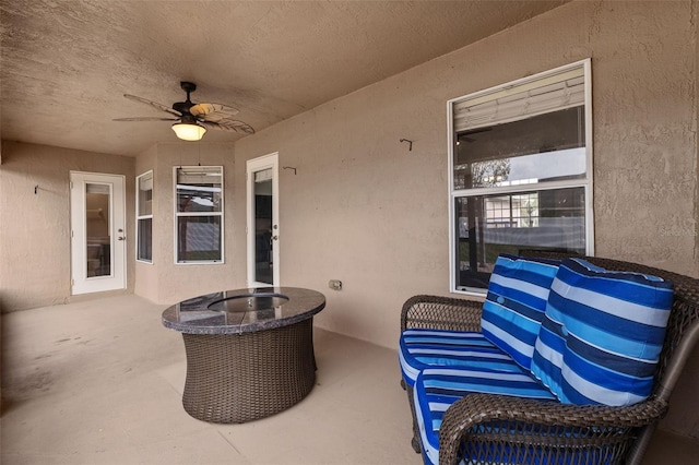 view of patio / terrace featuring ceiling fan