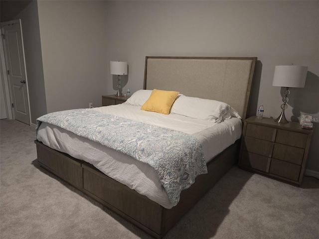 bedroom featuring light colored carpet