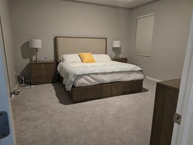 bedroom featuring carpet flooring and baseboards