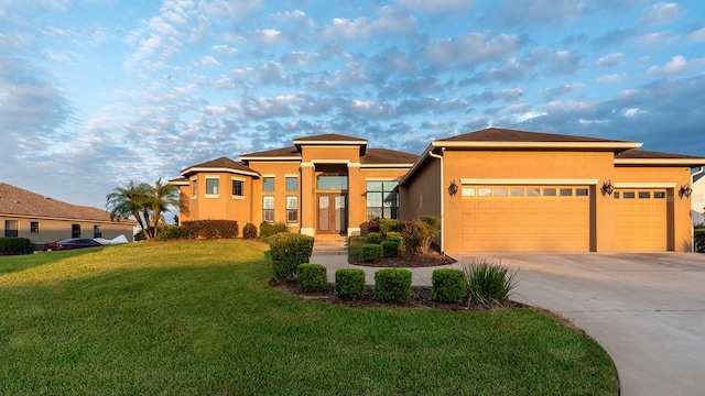 prairie-style house with a front yard and a garage