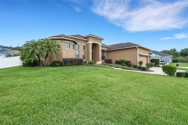 5074 Shore Side Dr, Lakeland, FL 33812 - view of front of house featuring stucco siding, a garage, and concrete driveway