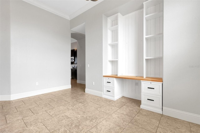 5074 Shore Side Dr, Lakeland, FL 33812 - unfurnished office with built in study area, crown molding, arched walkways, and baseboards