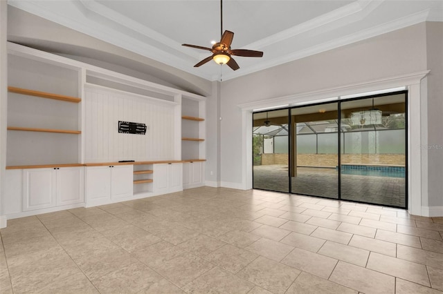 5074 Shore Side Dr, Lakeland, FL 33812 - unfurnished room with a ceiling fan, built in features, ornamental molding, a raised ceiling, and baseboards