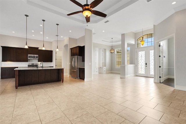5074 Shore Side Dr, Lakeland, FL 33812 - kitchen with appliances with stainless steel finishes, open floor plan, french doors, light tile patterned floors, and recessed lighting
