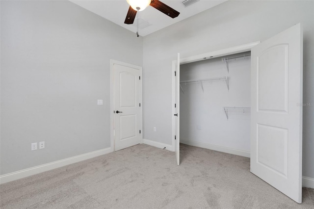 5074 Shore Side Dr, Lakeland, FL 33812 - unfurnished bedroom featuring carpet floors, a closet, ceiling fan, and baseboards