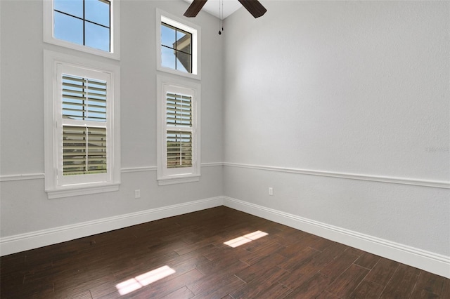 5074 Shore Side Dr, Lakeland, FL 33812 - empty room featuring ceiling fan, baseboards, dark wood-style floors, and plenty of natural light