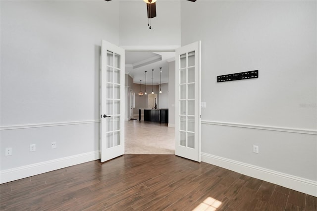 5074 Shore Side Dr, Lakeland, FL 33812 - unfurnished room featuring french doors, dark wood-style flooring, baseboards, and ceiling fan