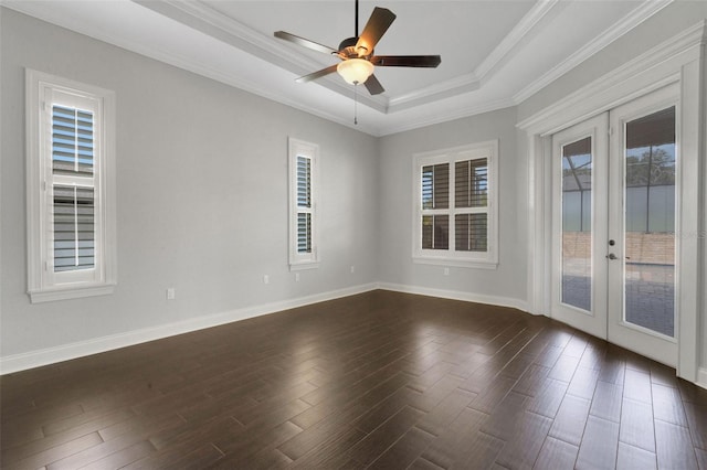 5074 Shore Side Dr, Lakeland, FL 33812 - spare room with french doors, a tray ceiling, dark wood-type flooring, baseboards, and ornamental molding