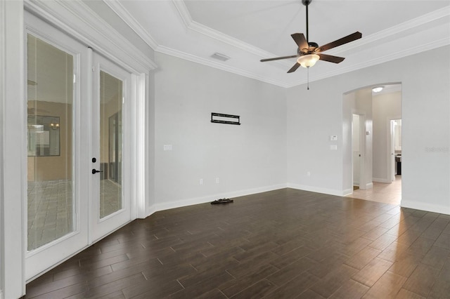 5074 Shore Side Dr, Lakeland, FL 33812 - unfurnished room with arched walkways, dark wood-style flooring, a ceiling fan, baseboards, and crown molding