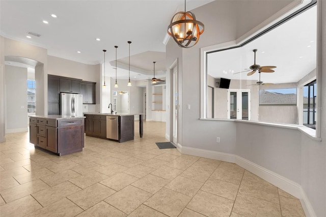 5074 Shore Side Dr, Lakeland, FL 33812 - kitchen with appliances with stainless steel finishes, a ceiling fan, a kitchen island with sink, baseboards, and recessed lighting
