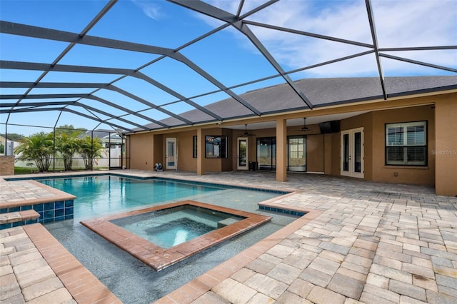 5074 Shore Side Dr, Lakeland, FL 33812 - view of pool featuring ceiling fan, a patio, french doors, a lanai, and a pool with connected hot tub