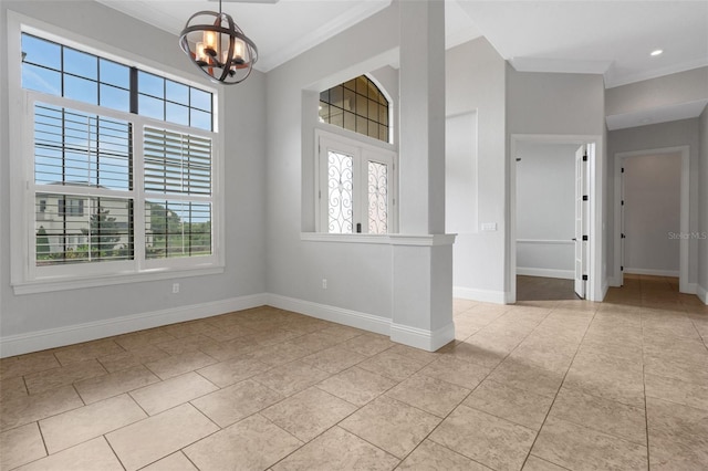 5074 Shore Side Dr, Lakeland, FL 33812 - spare room featuring plenty of natural light, light tile patterned floors, crown molding, a chandelier, and baseboards