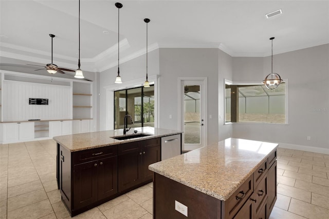 5074 Shore Side Dr, Lakeland, FL 33812 - kitchen featuring an island with sink, a sink, stainless steel dishwasher, light tile patterned floors, and crown molding
