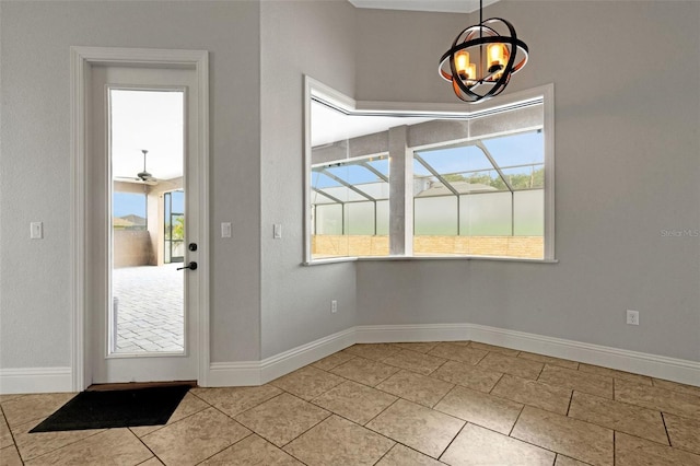 5074 Shore Side Dr, Lakeland, FL 33812 - unfurnished dining area with a chandelier, healthy amount of natural light, baseboards, and tile patterned floors