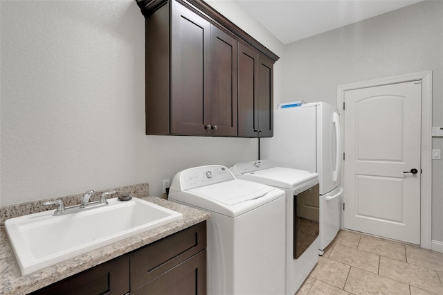 5074 Shore Side Dr, Lakeland, FL 33812 - washroom with cabinet space and washer and clothes dryer