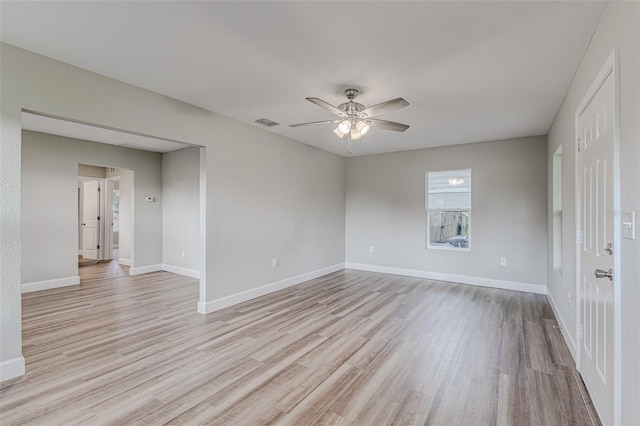 empty room featuring light wood-type flooring and ceiling fan