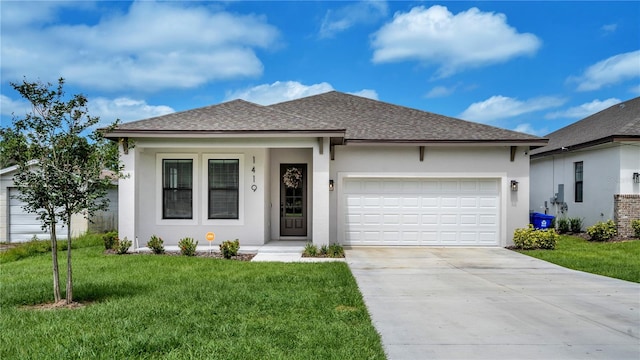 view of front facade with a front yard and a garage