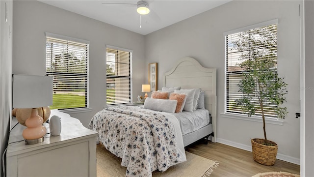 bedroom featuring light hardwood / wood-style flooring and ceiling fan