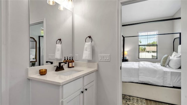 bathroom featuring vanity and hardwood / wood-style flooring