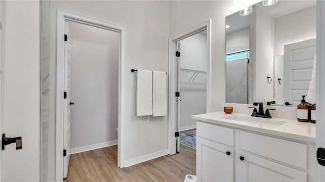 bathroom featuring vanity and hardwood / wood-style flooring