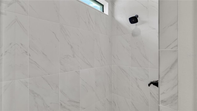 room details with a tile shower