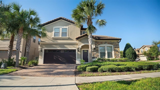 mediterranean / spanish-style house featuring a garage