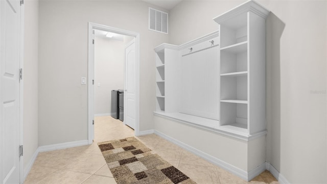 mudroom with light tile patterned flooring