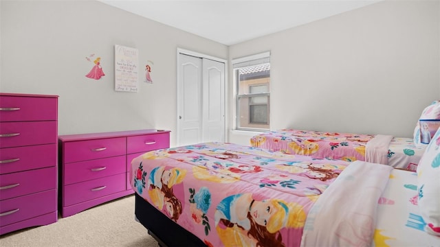 bedroom with a closet and carpet