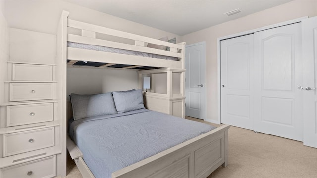 carpeted bedroom featuring a closet