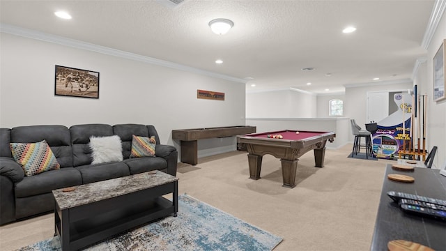 rec room featuring pool table, ornamental molding, a textured ceiling, and light colored carpet