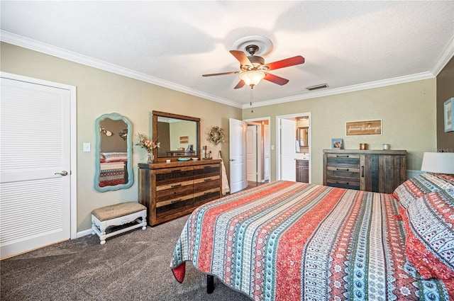 bedroom with ceiling fan, connected bathroom, carpet floors, ornamental molding, and a textured ceiling