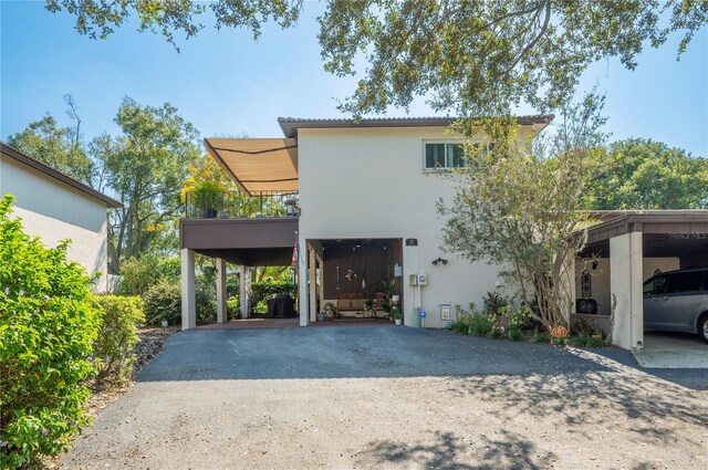 exterior space featuring a garage and a balcony