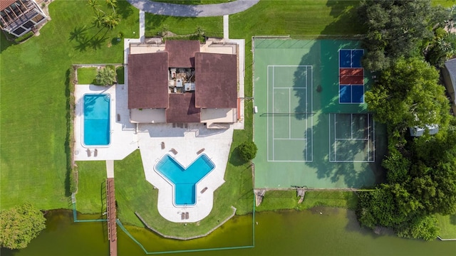 birds eye view of property with a water view