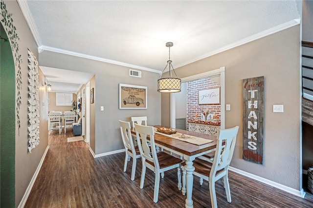 dining space featuring crown molding, dark hardwood / wood-style floors, and a textured ceiling