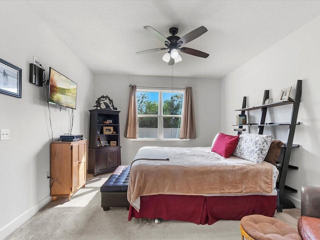 bedroom with ceiling fan and light carpet