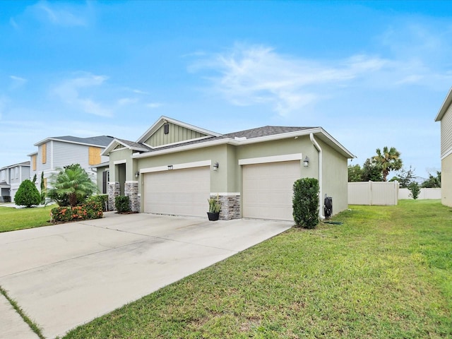 view of front of home with a garage and a front lawn