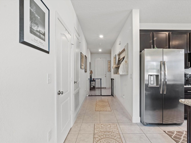 hallway with light tile patterned flooring