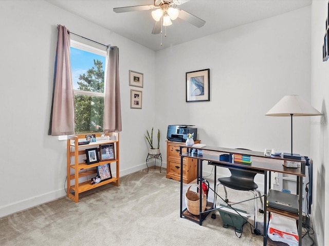 carpeted home office with ceiling fan