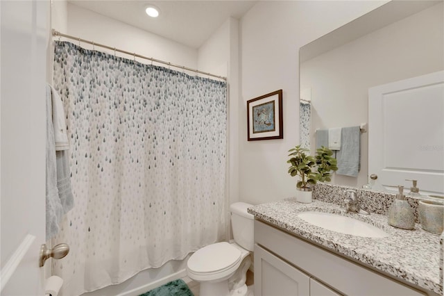 full bathroom featuring shower / tub combo with curtain, vanity, and toilet