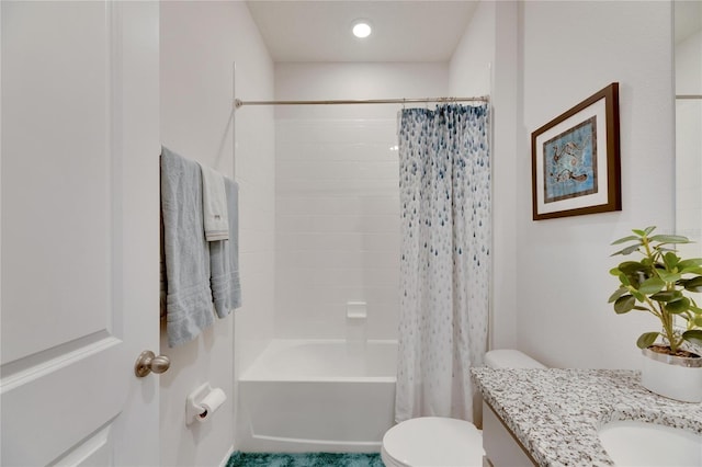 full bathroom with shower / tub combo with curtain, vanity, and toilet