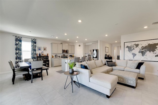 living room with light tile patterned flooring