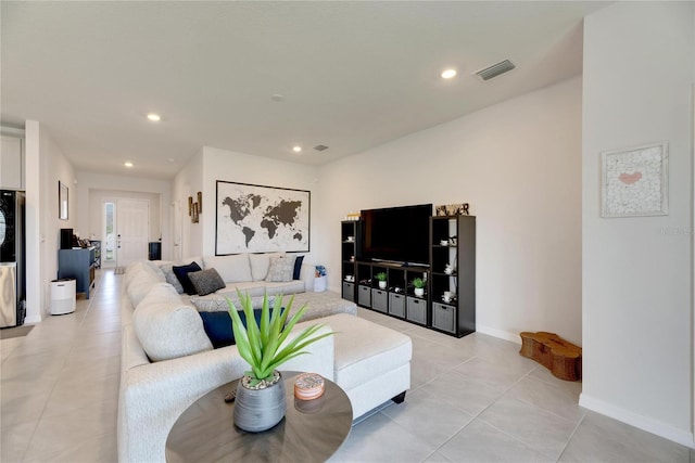 living room with light tile patterned flooring