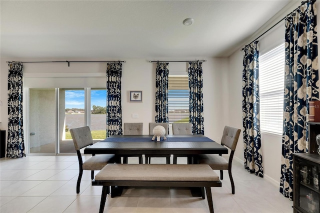 tiled dining room with plenty of natural light