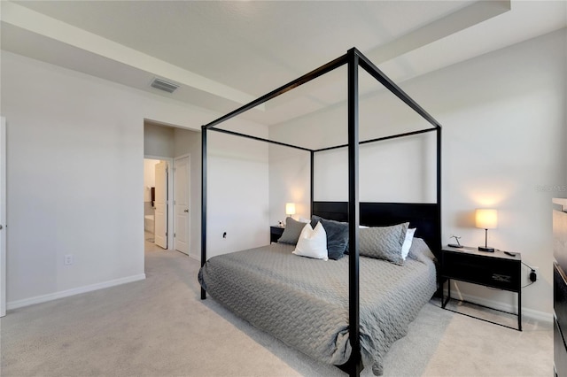 carpeted bedroom featuring connected bathroom