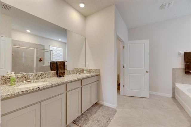 full bathroom featuring tile patterned floors, vanity, independent shower and bath, and toilet