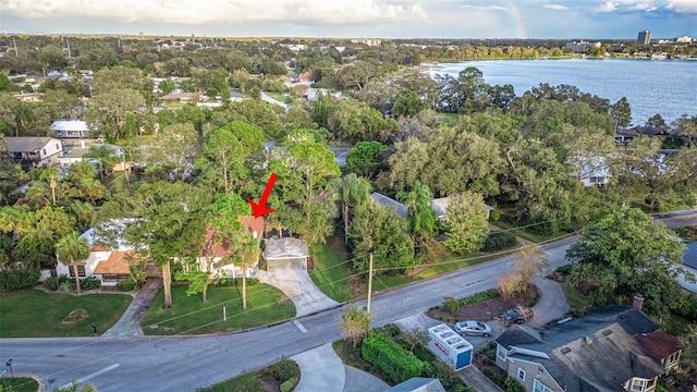 birds eye view of property with a water view